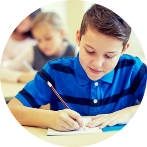 boy writing in notebook